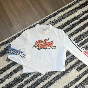 Rare, authentic streetfighter crop top I love TKO
Size L